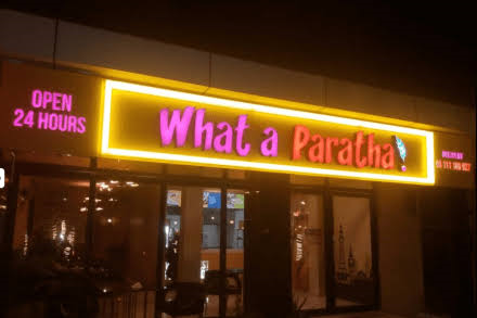 What A Paratha restaurant on Food Street in Bahria Town Phase 7 Rawalpindi serving stuffed parathas halwa puri nihari Pakistani breakfast BBQ and traditional desi cuisine